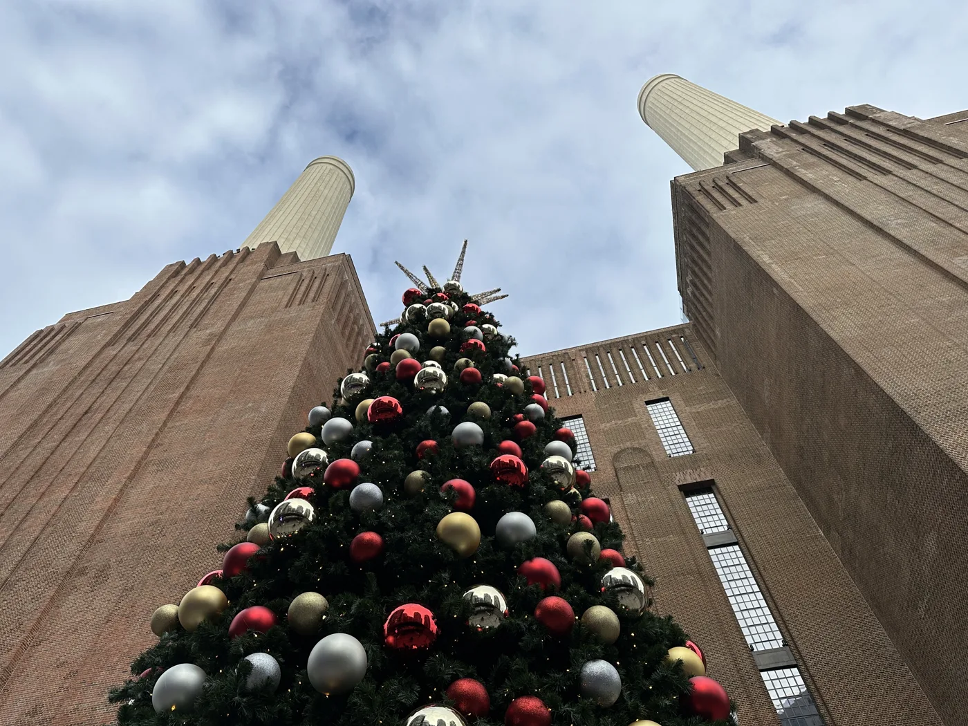 The Christmas tree beneath the chimneys at Battersea Power Station, where the Glide rink runs a New Year's Skate