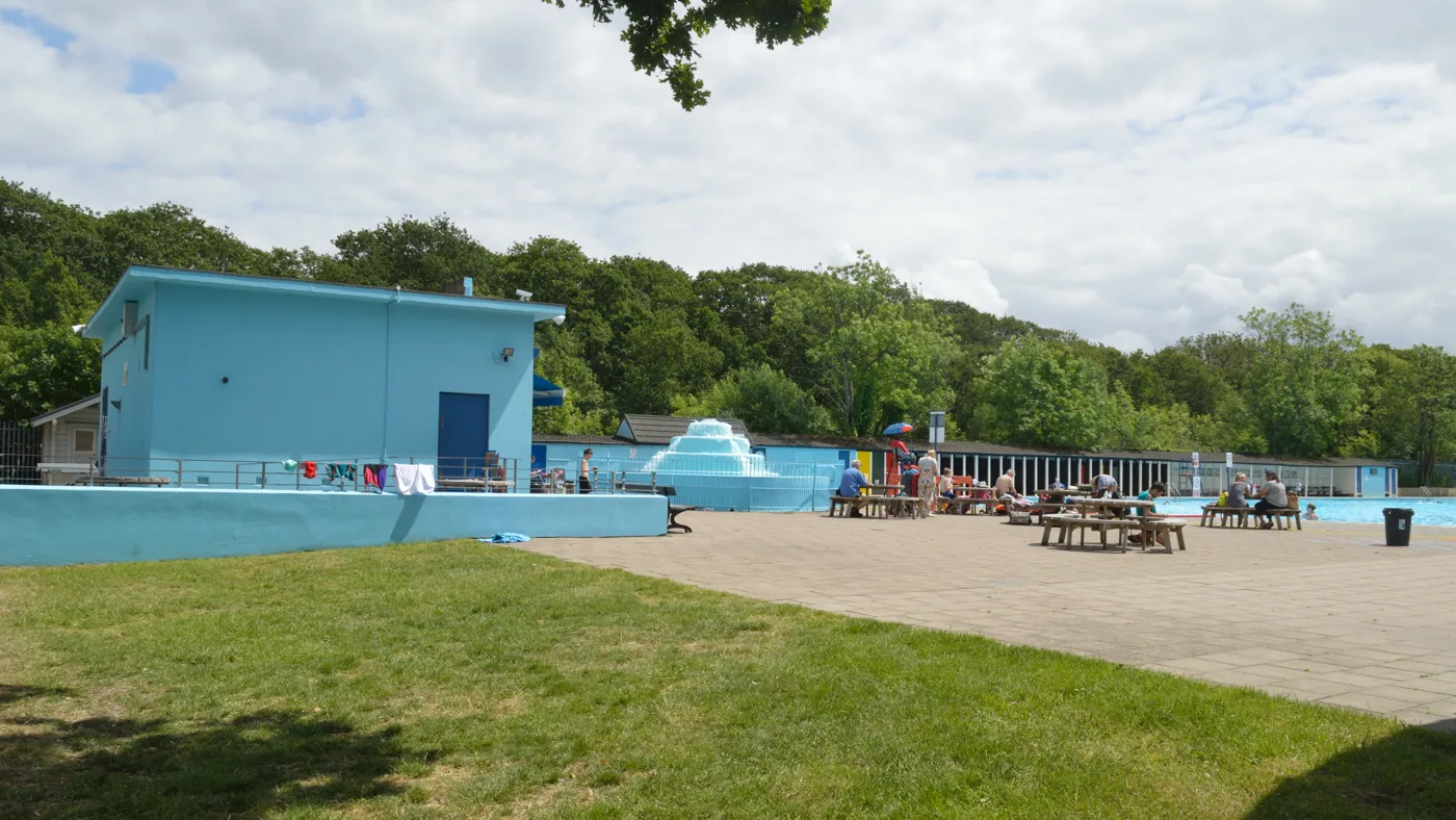 The poolside and fountain at Tooting Bec Lido on Tooting Bec Common, seen on a summer day rather than in the winter members' season