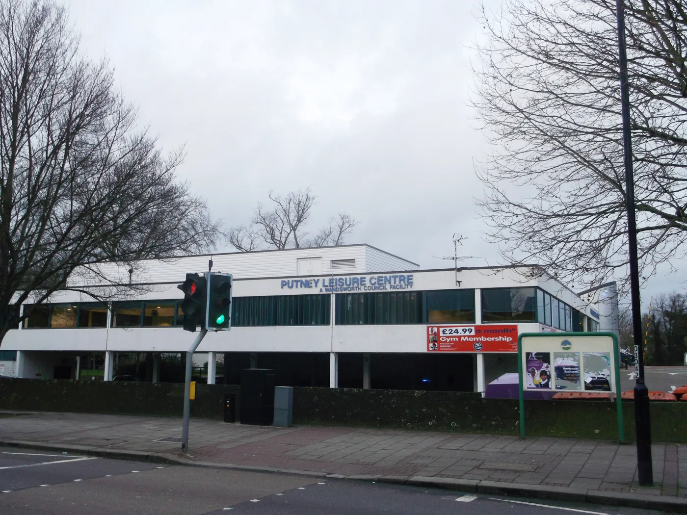 Putney Leisure Centre on Dryburgh Road, photographed in December 2012. The £24.99 gym price on the banner dates from then, not now.