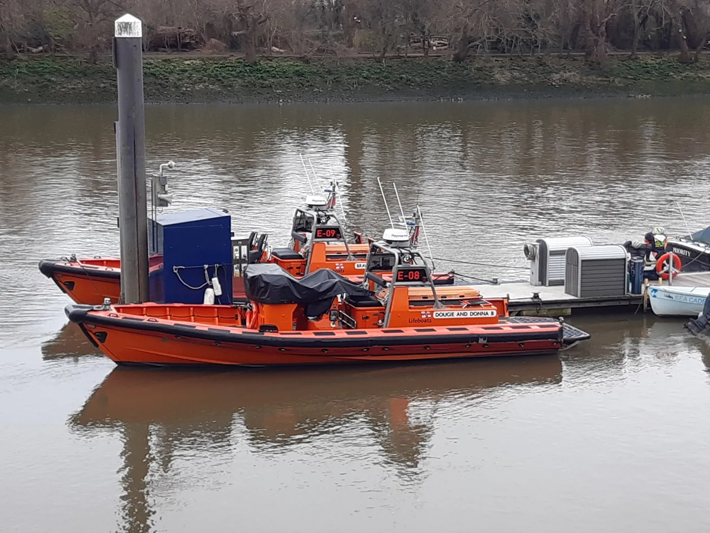 E-class lifeboats E-08 and E-09 moored on the Thames in 2024, when the station was still based at Chiswick. Both boats now operate from Wandsworth Riverside.